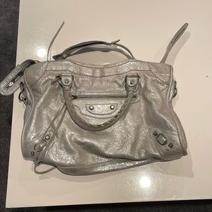 Classic Silver Balenciaga City Bag. Handles worn edges of leather slight cracks